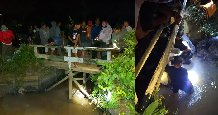 Warga desa Sumber Sari bersama petugas kepolisian mengevakuasi jasad Sopiansyah yang tersangkut di bawah jembatan kecil