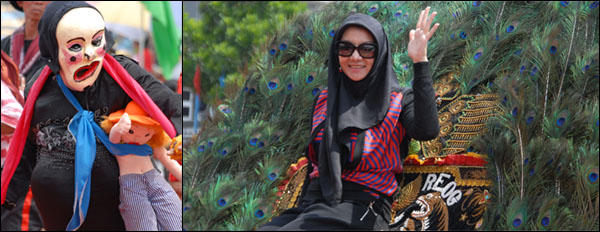 Aksi salah seorang peserta pawai yang menarik perhatian penonton, serta Bupati Rita Widyasari yang didaulat untuk naik Reog Ponorogo