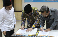 Ketua KNPI Kukar Junaidi bersama Kajari Kukar Kasmin menandatangani kerjasama bidang hukum/perdata