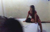 Salah seorang wanita yang kepergok sekamar dengan pria yang bukan suaminya 