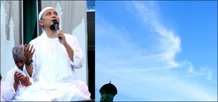 Ustadz Arifin Ilham memimpin doa sambil sesekali menengok ke atas langit pada gumpalan awan yang membentuk lafadz Allah